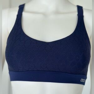 Lorna Jane sports bra in navy blue size X Small to small adjustable wide straps.